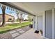 Charming covered patio with pavers, green space, and view of mature trees at 7346 S Xenia Cir # A, Centennial, CO 80112