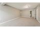 Large basement area with neutral carpet, providing flexible space for recreation or storage at 5243 Union Ct # 4, Arvada, CO 80002
