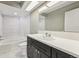 Bathroom featuring sleek vanity, a combination tub and shower with tiled surround and recessed lights at 5243 Union Ct # 4, Arvada, CO 80002