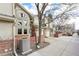 Charming townhome with brick accents, an attached garage, mature trees and a well-maintained front yard at 5243 Union Ct # 4, Arvada, CO 80002