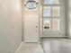 Inviting foyer with a soaring ceiling, updated flooring, and lots of natural light from the large windows at 5243 Union Ct # 4, Arvada, CO 80002