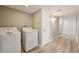 Convenient laundry area with a side-by-side washer and dryer, and storage space at 5243 Union Ct # 4, Arvada, CO 80002