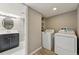 Convenient laundry room with washer, dryer, vanity, and ample shelving for storage at 5243 Union Ct # 4, Arvada, CO 80002
