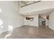 Open-concept living room features hardwood floors, loft, and seamless flow to kitchen at 5243 Union Ct # 4, Arvada, CO 80002
