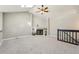 Cozy living room features vaulted ceiling, skylight, brick fireplace, and plush carpeting at 5243 Union Ct # 4, Arvada, CO 80002