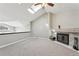 Bright living room features a fireplace, skylight, vaulted ceiling, and neutral carpet at 5243 Union Ct # 4, Arvada, CO 80002
