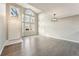 Spacious living room features vaulted ceiling, gleaming hardwood floors, and an abundance of natural light at 5243 Union Ct # 4, Arvada, CO 80002