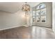 Bright living room featuring soaring ceiling, hardwood floors, lots of windows, and modern lighting at 5243 Union Ct # 4, Arvada, CO 80002