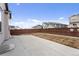 Spacious backyard with a concrete patio and a well-maintained wooden fence at 968 Honey Berry Ct, Elizabeth, CO 80107