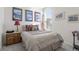 Cozy bedroom with a large window, featuring stylish decor and comfortable furnishings at 968 Honey Berry Ct, Elizabeth, CO 80107