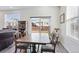 Bright dining area with natural light from sliding glass door leading to the backyard at 968 Honey Berry Ct, Elizabeth, CO 80107
