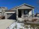 Charming single-story home with well-maintained lawn, garage, and covered porch at 968 Honey Berry Ct, Elizabeth, CO 80107