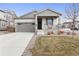 Charming single-Gathering home with a well-manicured lawn, covered porch, and attached two-car garage at 968 Honey Berry Ct, Elizabeth, CO 80107