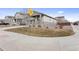 Neighborhood home showcasing professional landscaping and a covered front porch at 968 Honey Berry Ct, Elizabeth, CO 80107