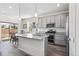 Modern kitchen with stainless steel appliances, granite countertops, and an island sink at 968 Honey Berry Ct, Elizabeth, CO 80107