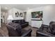 Bright living room featuring luxury vinyl plank flooring and recessed lighting at 968 Honey Berry Ct, Elizabeth, CO 80107
