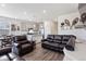 Open-concept living room featuring luxury vinyl plank flooring and recessed lighting at 968 Honey Berry Ct, Elizabeth, CO 80107