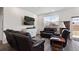Living room with recessed lights and an entertainment center at 968 Honey Berry Ct, Elizabeth, CO 80107