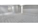 Spacious finished basement with neutral carpet, recessed lighting, and white trim throughout at 8581 Eckley St, Littleton, CO 80125
