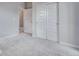 Bedroom with neutral carpet, large closet, and recessed lighting at 8581 Eckley St, Littleton, CO 80125