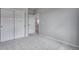 Neutral bedroom boasts carpet floors, closet, and doorway leading to other spaces at 8581 Eckley St, Littleton, CO 80125