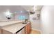 Stylish bar area featuring ample counter space and wooden cabinets at 11560 River Run Cir, Commerce City, CO 80640