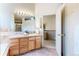 Bright bathroom with a large vanity, tub, and a separate shower at 11560 River Run Cir, Commerce City, CO 80640