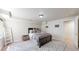 Cozy bedroom featuring neutral tones, a comfortable bed, and stylish decor at 11560 River Run Cir, Commerce City, CO 80640