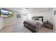 Relaxing bedroom with a TV, rug and decor accents for a cozy retreat at 11560 River Run Cir, Commerce City, CO 80640
