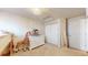 Cozy bedroom featuring a dresser and closet, with a charming giraffe accent at 11560 River Run Cir, Commerce City, CO 80640