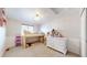 Bright bedroom with carpet, a whimsical loft bed, and cheerful decor for a kid at 11560 River Run Cir, Commerce City, CO 80640