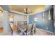 Dining area featuring modern decor, a decorative chandelier, and a rustic table at 11560 River Run Cir, Commerce City, CO 80640
