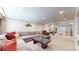 Open concept living room with comfortable seating at 11560 River Run Cir, Commerce City, CO 80640