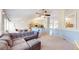 Spacious living room with vaulted ceilings, plush carpet, and neutral paint at 11560 River Run Cir, Commerce City, CO 80640