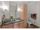 Bathroom with granite vanity and large mirror at 5455 Landmark Pl # 604, Greenwood Village, CO 80111