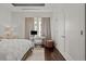 Bedroom with built-in workspace and hardwood floors at 5455 Landmark Pl # 604, Greenwood Village, CO 80111
