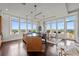 Open concept dining area with hardwood floors and city views at 5455 Landmark Pl # 604, Greenwood Village, CO 80111