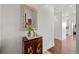 Elegant entryway with ornate mirror and stylish wood cabinet at 5455 Landmark Pl # 604, Greenwood Village, CO 80111