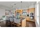 Modern kitchen with island seating and hardwood floors at 5455 Landmark Pl # 604, Greenwood Village, CO 80111