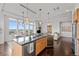 Island kitchen with wine cooler and hardwood floors at 5455 Landmark Pl # 604, Greenwood Village, CO 80111