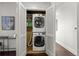 Convenient laundry room with stackable washer and dryer at 5455 Landmark Pl # 604, Greenwood Village, CO 80111