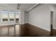 Bright and airy living room with hardwood floors and city view at 5455 Landmark Pl # 604, Greenwood Village, CO 80111