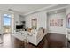 Living room with comfy seating and access to a balcony at 5455 Landmark Pl # 604, Greenwood Village, CO 80111