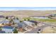 Scenic aerial captures the home's location near a pond, golf course, and rolling hillsides at 1461 Hickory Ct, Erie, CO 80516