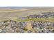 Expansive aerial view of the neighborhood with multiple community amenities and open natural spaces at 1461 Hickory Ct, Erie, CO 80516