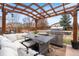 Cozy backyard with outdoor seating, grill, and stylish pergola at 1461 Hickory Ct, Erie, CO 80516