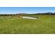 Scenic community golf course and pond offers residents a tranquil escape and outdoor recreation opportunities at 1461 Hickory Ct, Erie, CO 80516