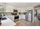 Well-equipped kitchen with stainless steel appliances, ample storage, and bright white cabinetry at 1461 Hickory Ct, Erie, CO 80516