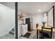 Cozy kitchenette with stainless steel refrigerator, sink, and wooden dining table set at 1461 Hickory Ct, Erie, CO 80516