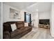 Comfortable living room with a couch, TV, exercise bike and natural light at 1461 Hickory Ct, Erie, CO 80516
